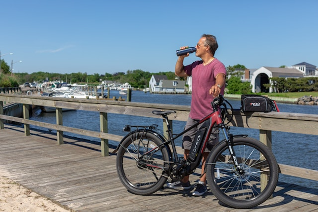 Man drinking water in a city